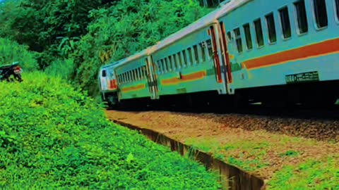 Indonesian train crossing a long bridge aesthetic video