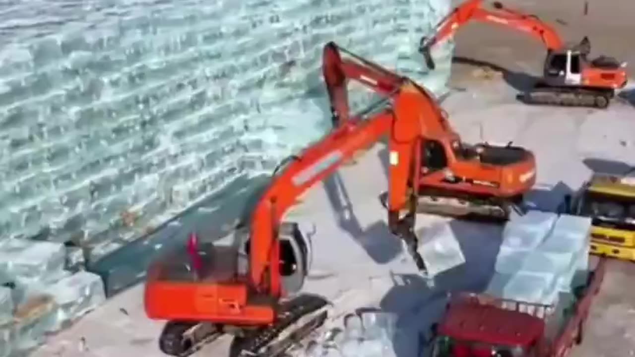 On the Songhua River, iceman carve large ice blocks for the Harbin International Ice & Snow Festival