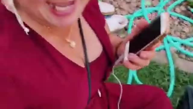 Girl gives her mom random objects while she’s on the phone...