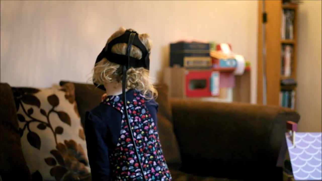 Little girl explores VR dollhouse