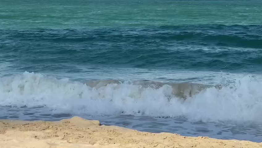 Waves of Dubai Beach Green and Blue water