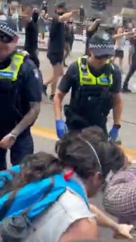 Nazi salutes from men in balaclavas marching in Melbourne