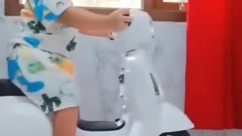 Cute baby on bicycle