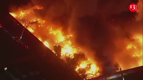 More than 100 firefighters work to contain massive fire at California commercial complex