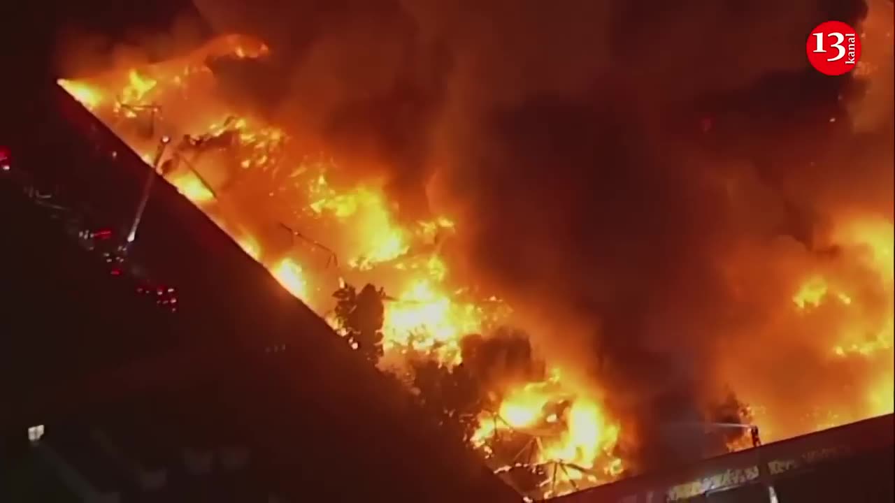 More than 100 firefighters work to contain massive fire at California commercial complex