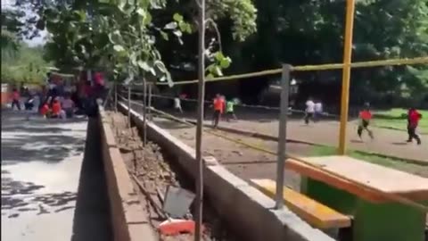 Students and teachers are seen running and taking cover after shooting occurred...