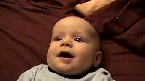 Greggory as a baby cooing