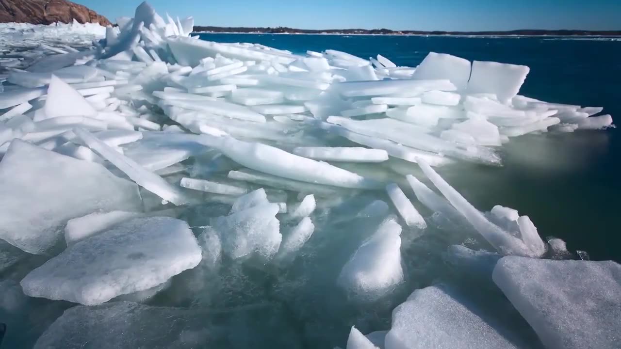 Frozen Ice on Ocean and Mountain