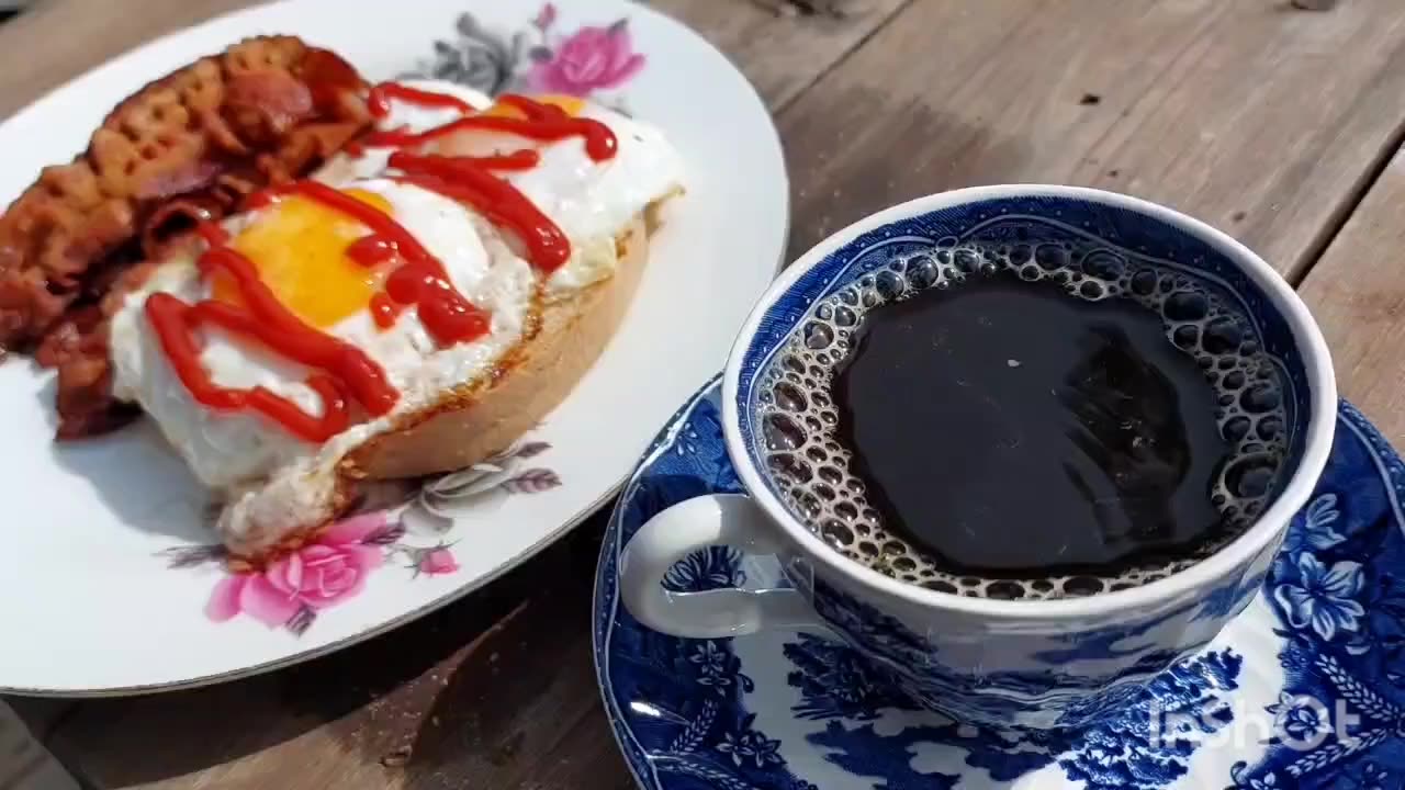 Egg & bacon made on the bonfire pan.