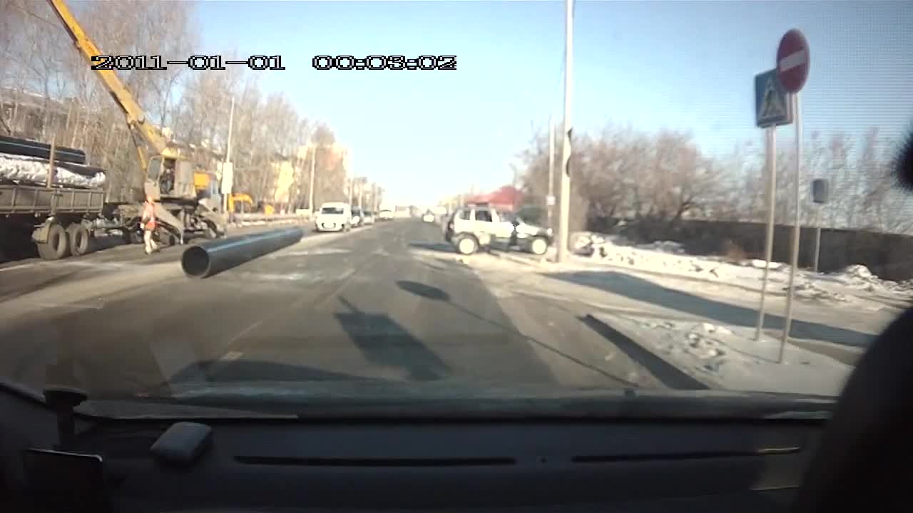 Construction Pipe Takes Out Passing Car