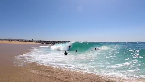 Surfing and Skimboarding WEDGE on massive HIGH TIDE