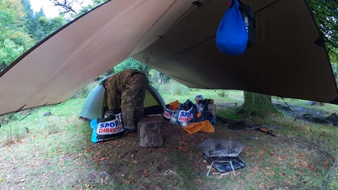 Taking out gear from inside the tent to break down the tent. Speedlapse