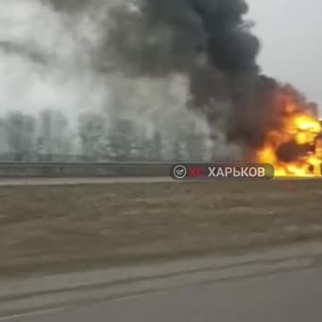 Burning truck on the highway in Kharkiv