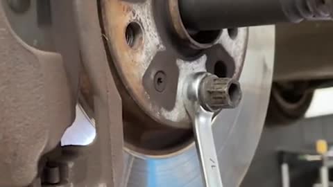 Remove the big nut to fix the brake disc.