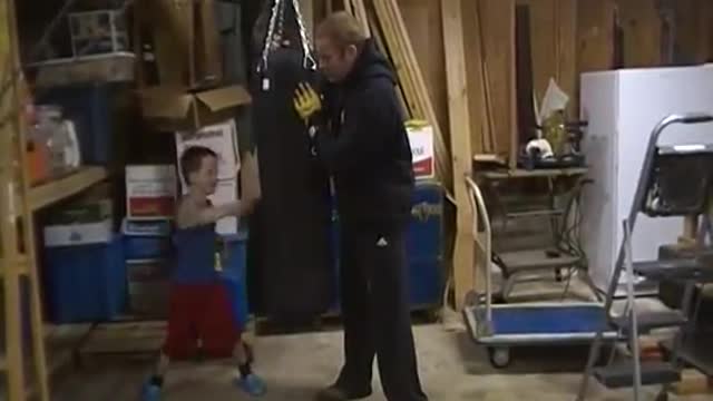 Trevor and Max Walsh working the boxing bag when Max was a wee lad