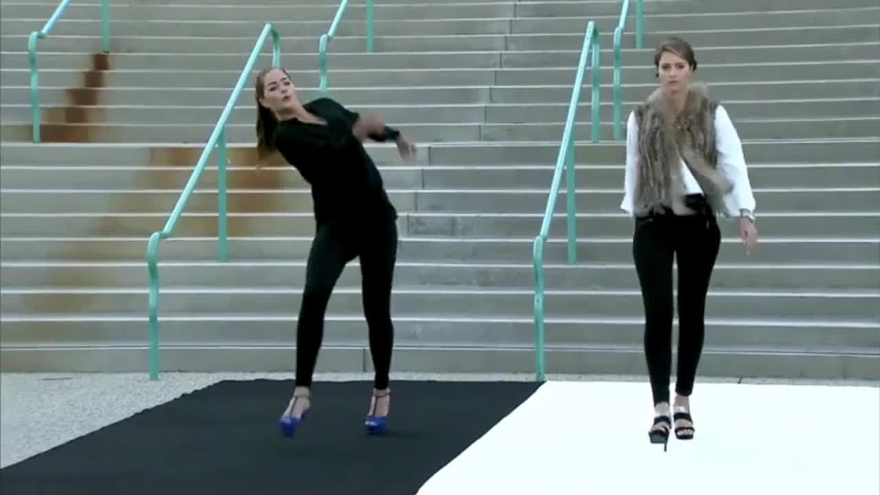 Model FALLS down in high heels during an outdoor German Fashion Show