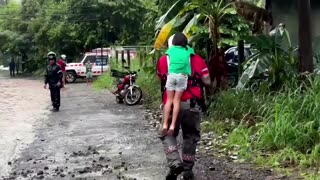 Rescue teams help Costa Ricans trapped by floods