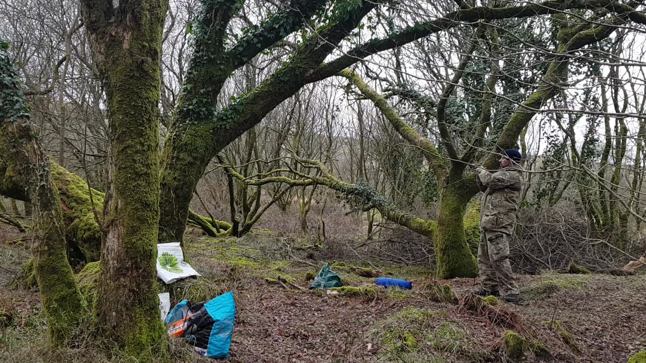 Taking down the tarp and packing it away. DARTMOOR 26th March 2023