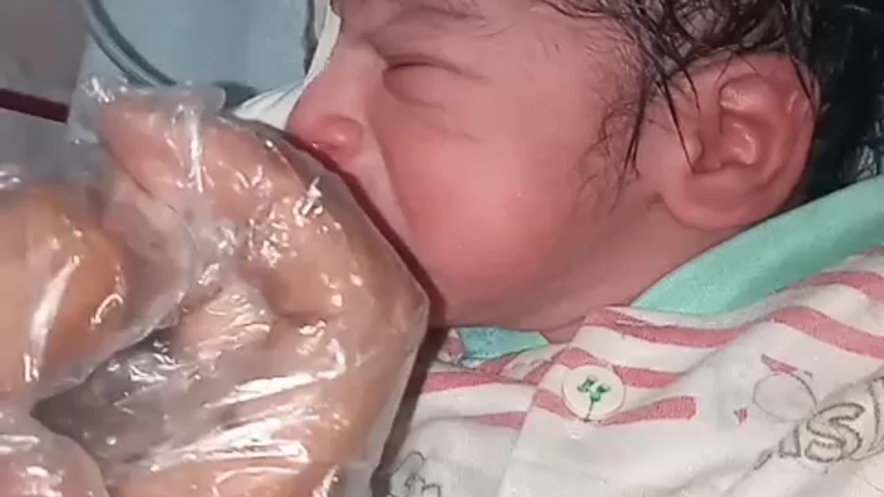 New born baby cleaning with soap and oil