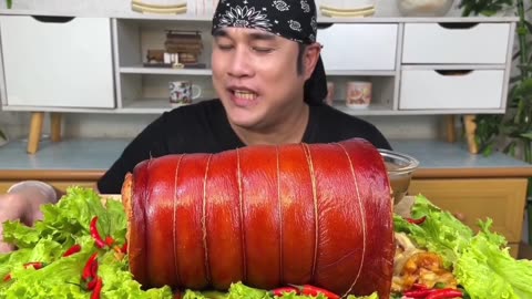 Outdoor cooking spicy pork lechon with monzirilla cheese.