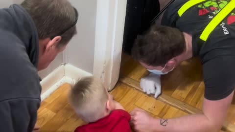 Distressed Toddler has Fingers Freed by Rescue Workers