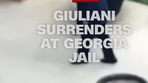 Rudy Giuliani Shakes Everyone's Hand Arriving at the Jail Today