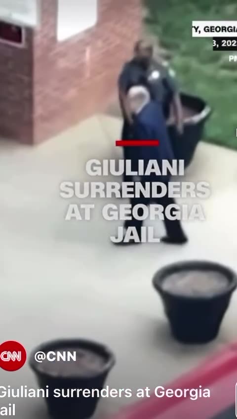 Rudy Giuliani Shakes Everyone's Hand Arriving at the Jail Today