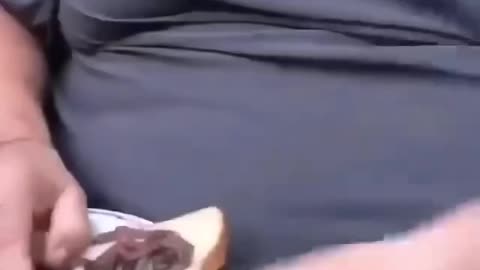 Man eats a worm sandwich 🤢