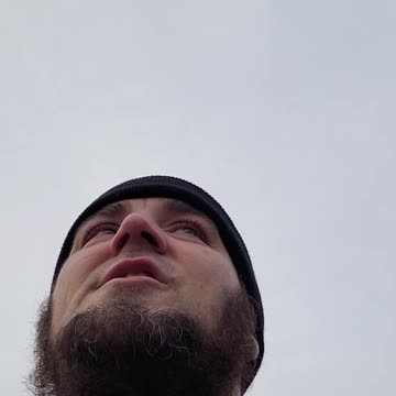 Man wearing mask in car by himself