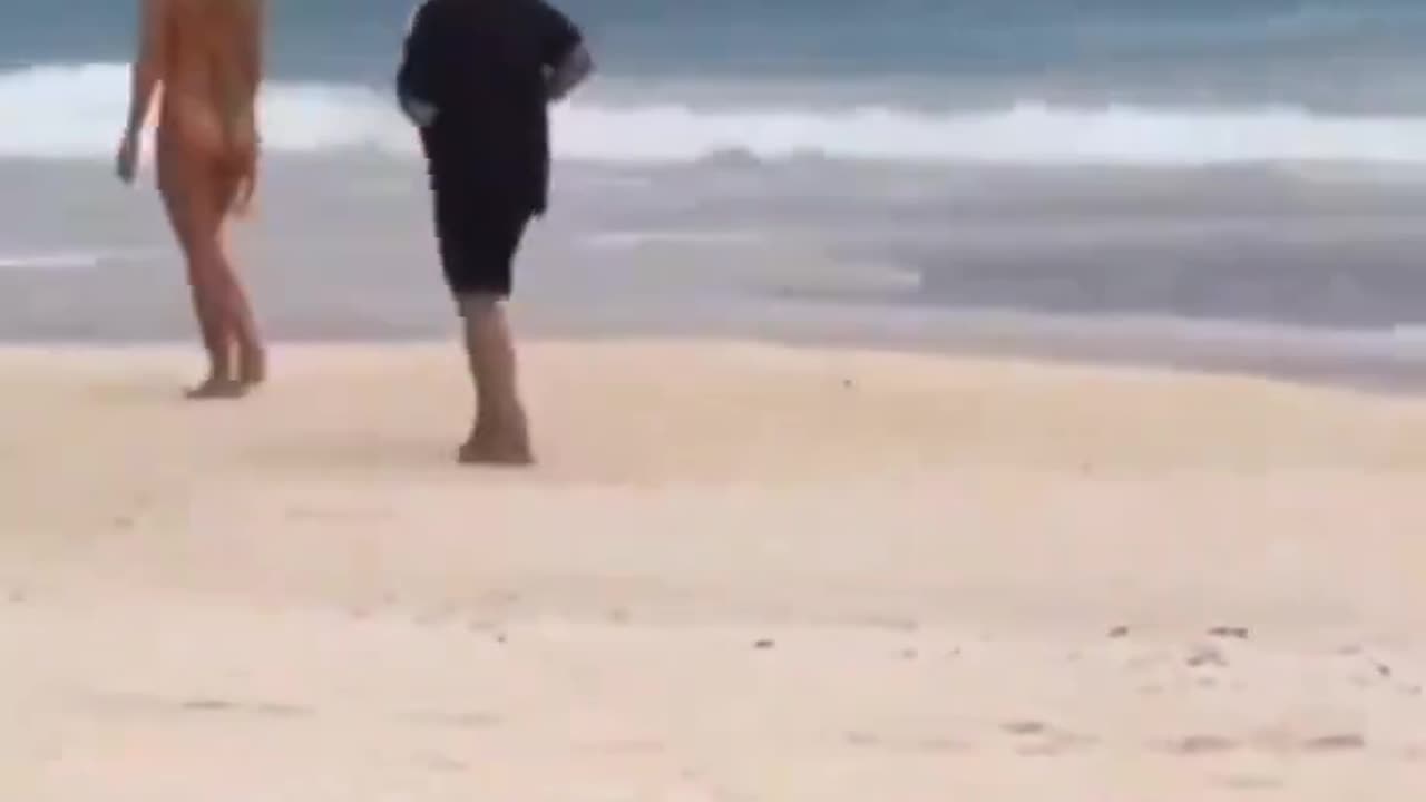 man training his heart out at the beach