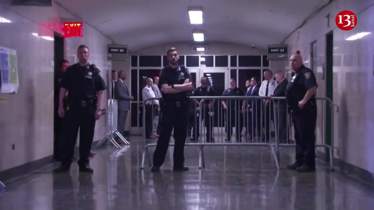 Former President Trump is seen in the court hallway before his arraignment