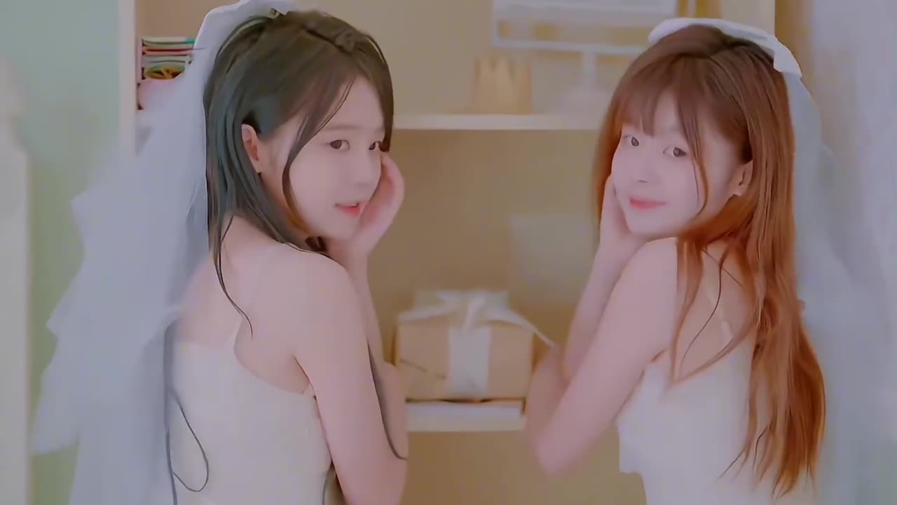 two cute girls in wedding dresses