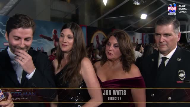 Director Jon Watts is Surrounded By Heroes Spider-Man No Way Home Red Carpet