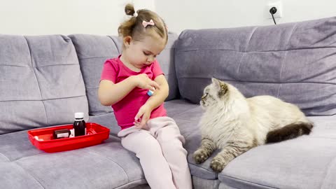 Baby Girl Provides Vet Care to Fluffy Cat [TRY NOT TO LAUGH]