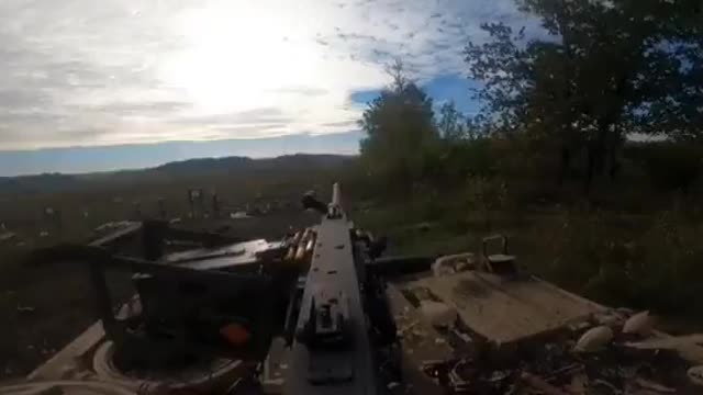 Ukrainian soldier firing from a US-supplied M113 APC.