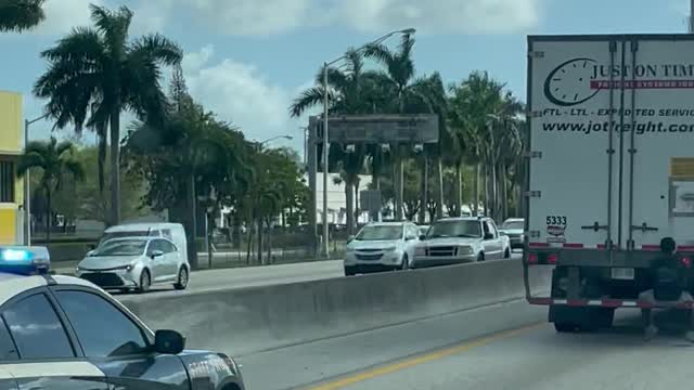 Man Spotted Sitting on Tractor Trailer