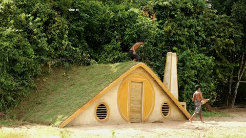 One Week Spent Building A Hobbit House With A Beautiful Garden in Front