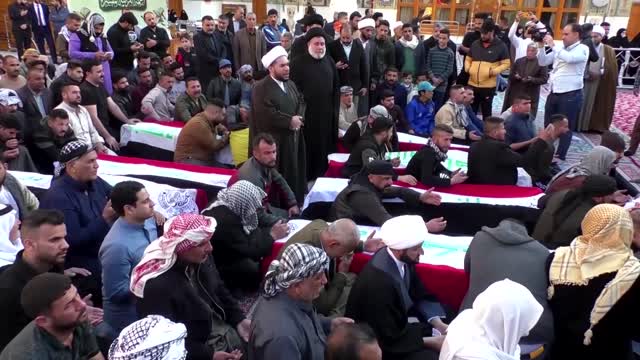 Mourners attend funeral for eight Iraqis shot by gunmen