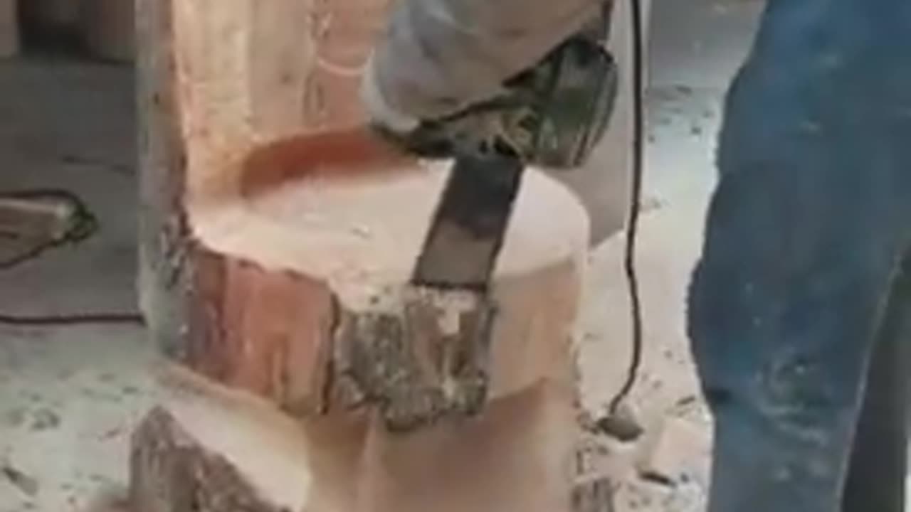 Boy carving a wooden piece into a chair!!!