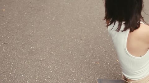 Women Sitting on Skateboards