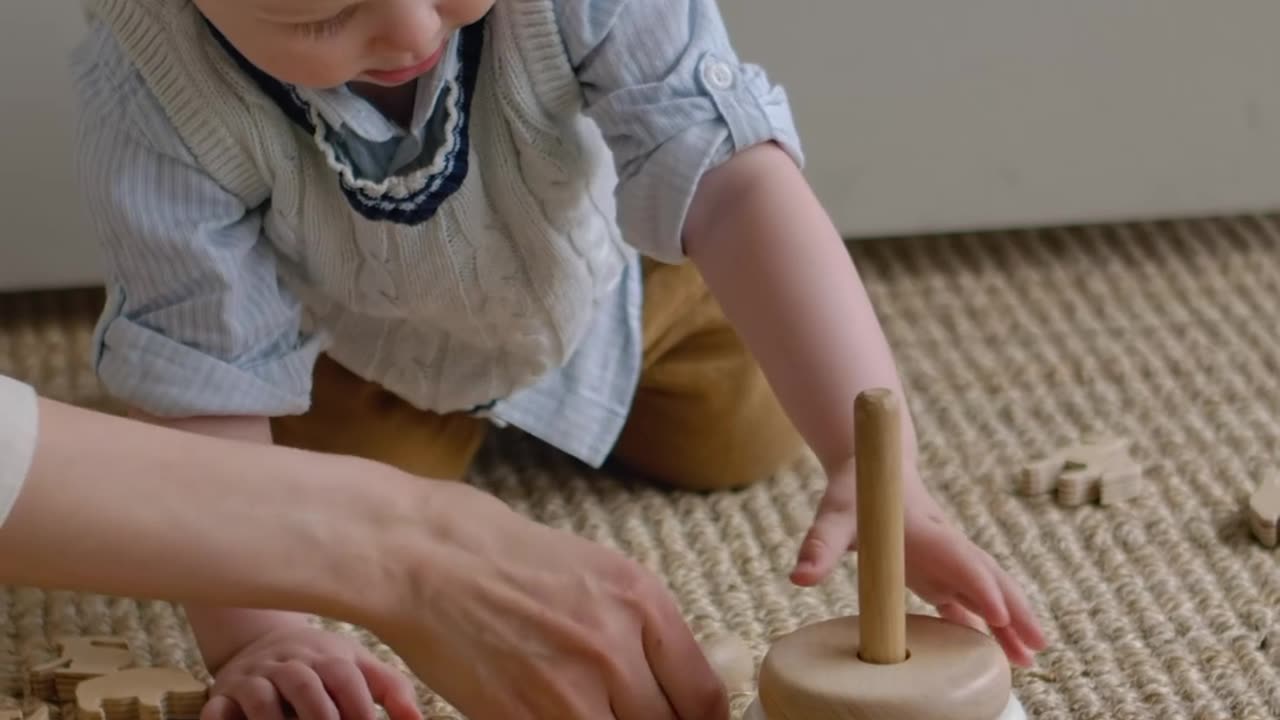 cute little boy playing with mom