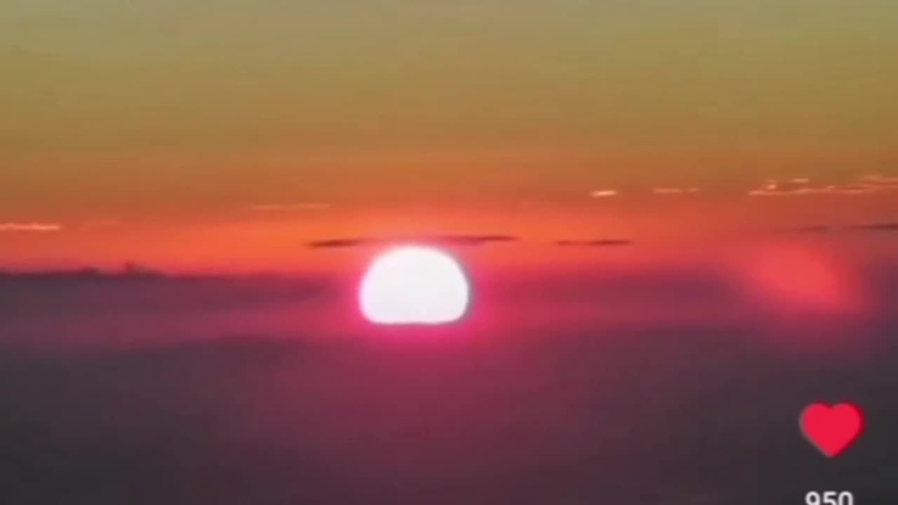 Sun Rising Out Of Clouds In Front Of The Horizon