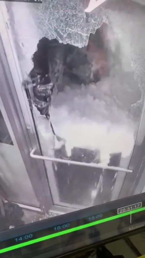 Footage shows a liquor store in Buffalo getting broken into and robbed