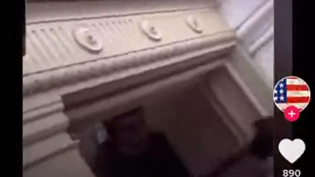 Weapons being handed to terrorist from an open window in the Capitol.