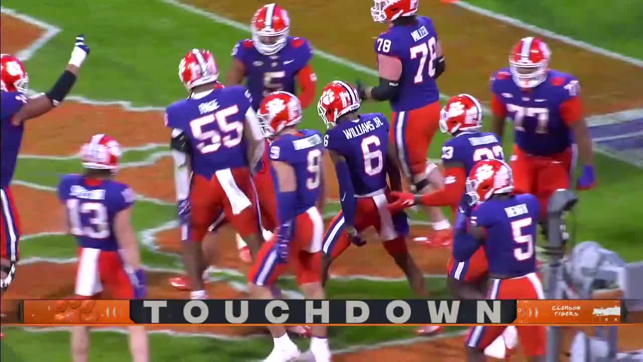 Clemson’s Will Shipley HURDLES a defender on his way to the end zone