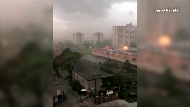 Trampoline flies between cars during storm in Toronto