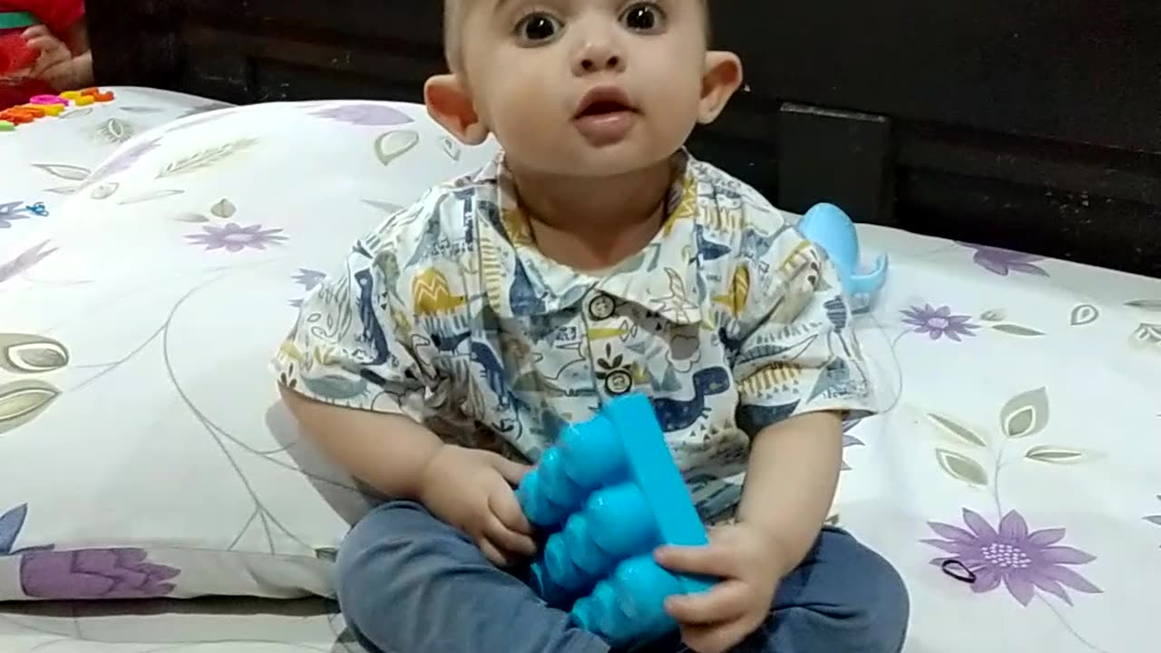 Cute baby playing with Toys