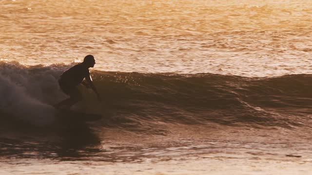 A woman practicing surfing