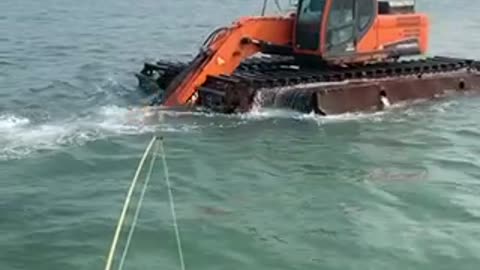 Excavator in the sea