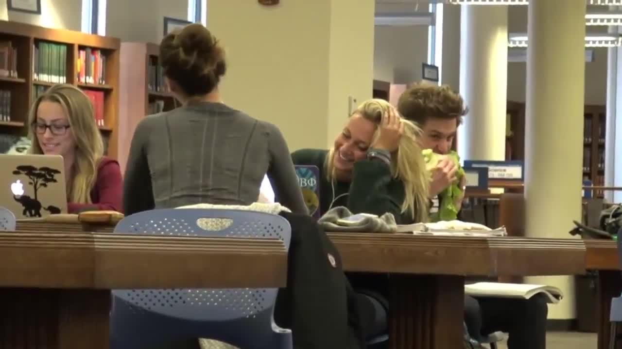 Funny video of a young man eating in a strange way among people